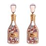 Vintage champagne bottle full of diamond-studded pearl earrings