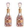 Vintage champagne bottle full of diamond-studded pearl earrings