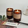 Elegant Tinted Scented Candles in a Brown Glass Jar with Lid