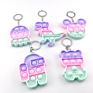 Popular Silicone Fidget Christmas Bells Gingerbread Candy Key Chain Set Bubble Fidget Mini Push Popping Keychain