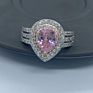 Customized Sparkling 10*7Mm Pear Cut Pink Moissanite Engagement Three Stone Ring